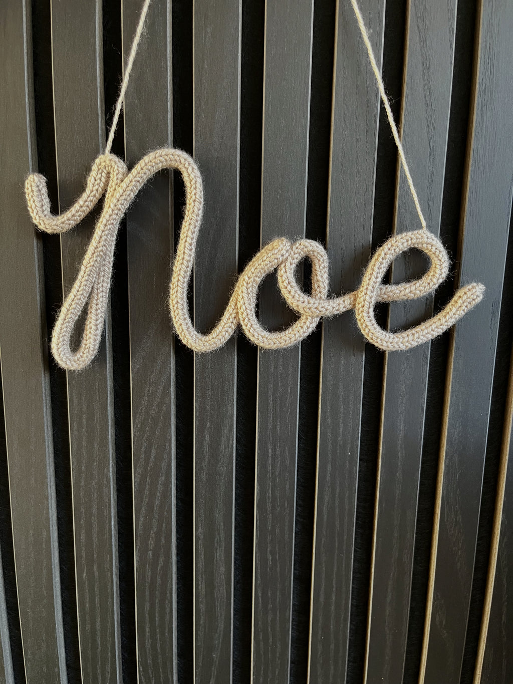 naamhanger (3 letters)