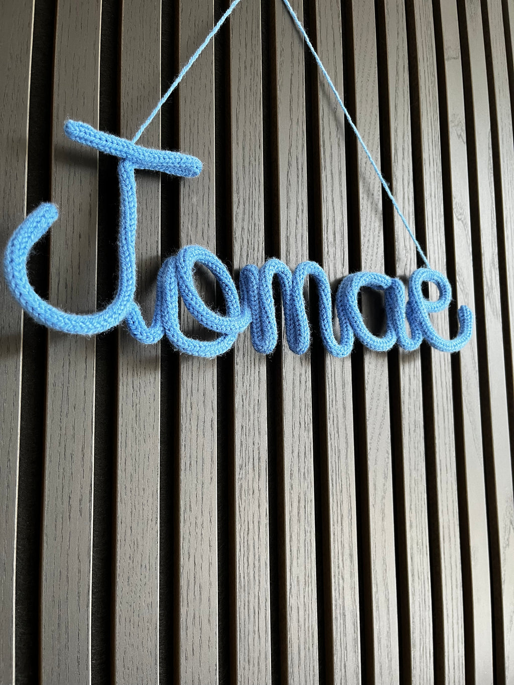 naamhanger (5 letters)
