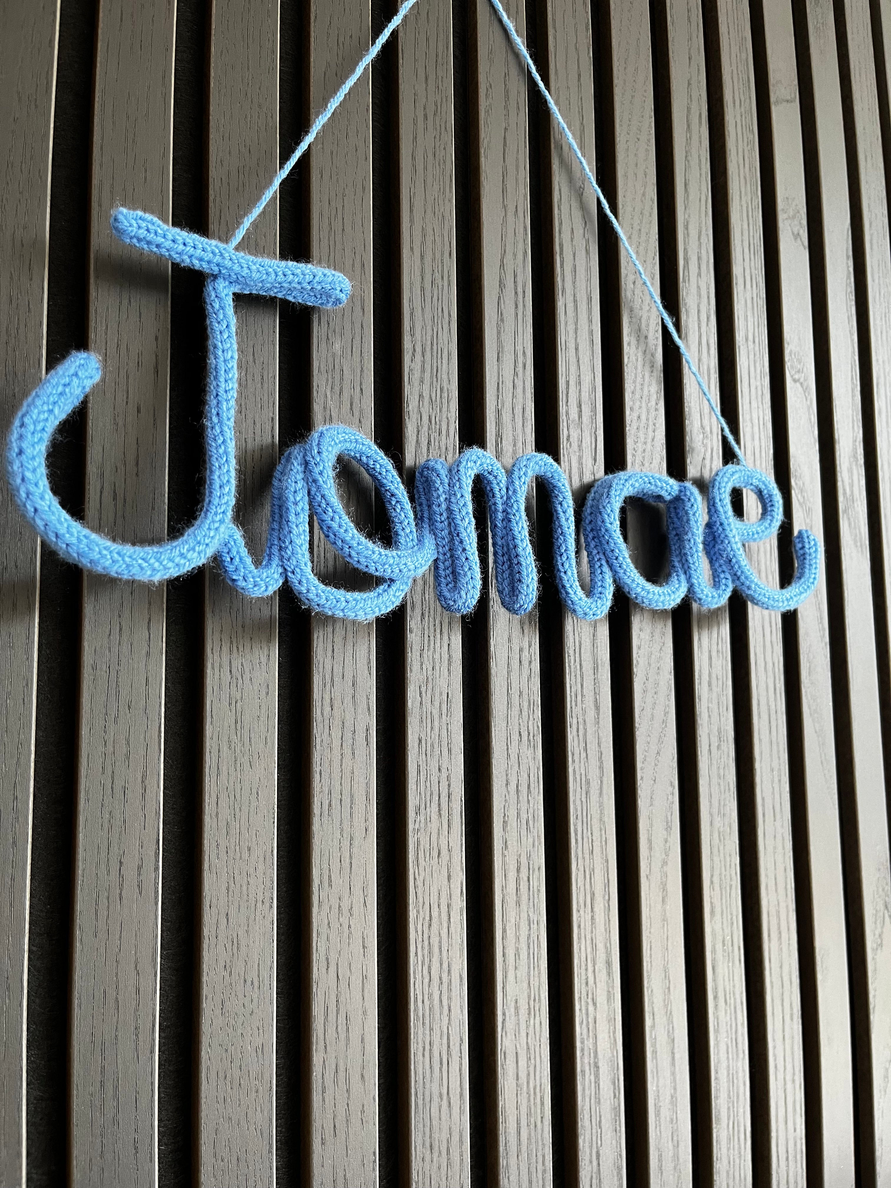 naamhanger (5 letters)